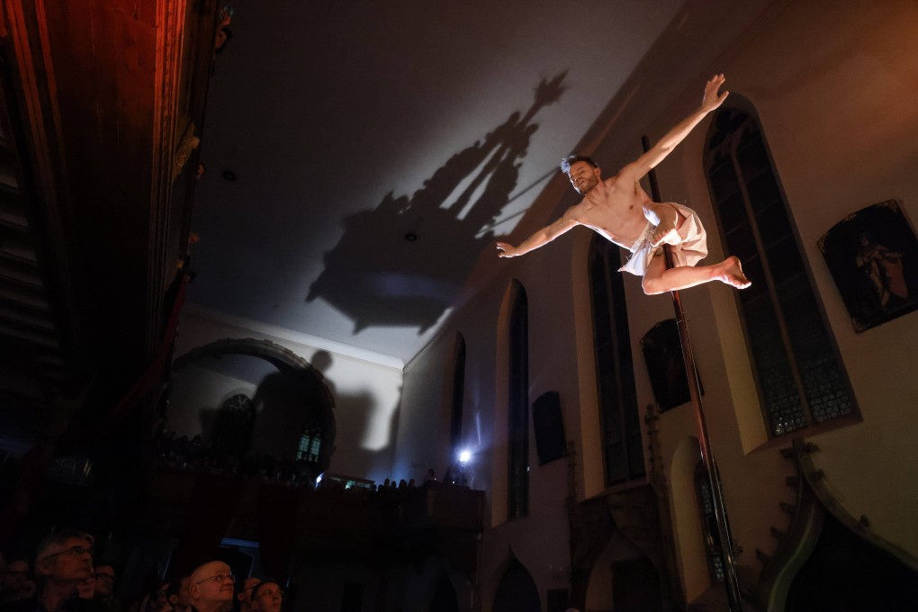 European pole dance champion, Vincent Grobelny performs at the Saint-Guillaume Church in Strasbourg, France on March 29. Photo: AP