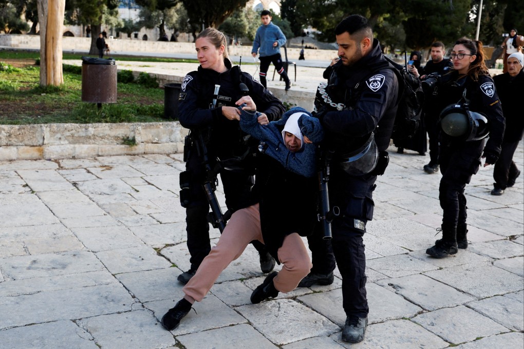 Israeli border police detain a Palestinian woman at the Al-Aqsa Mosque compound in Jerusalem’s Old City on Wednesday. Photo: Reuters