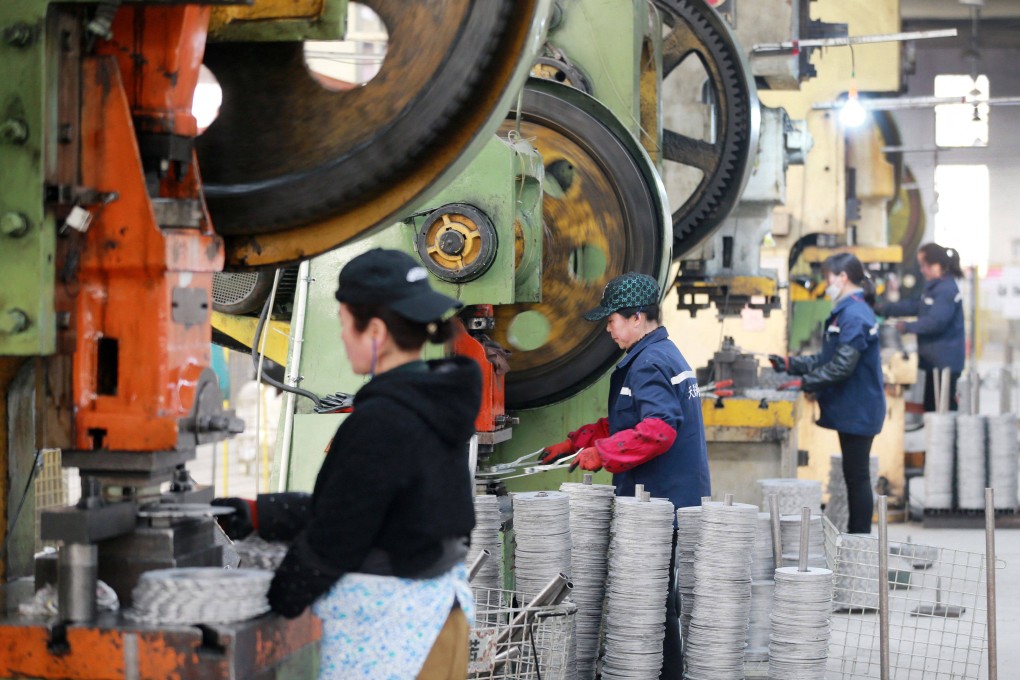 Employees work on aluminium products at a factory in Huaibei, in China’s eastern Anhui province, on January 30. China’s workforce is not getting any younger. Photo: AFP