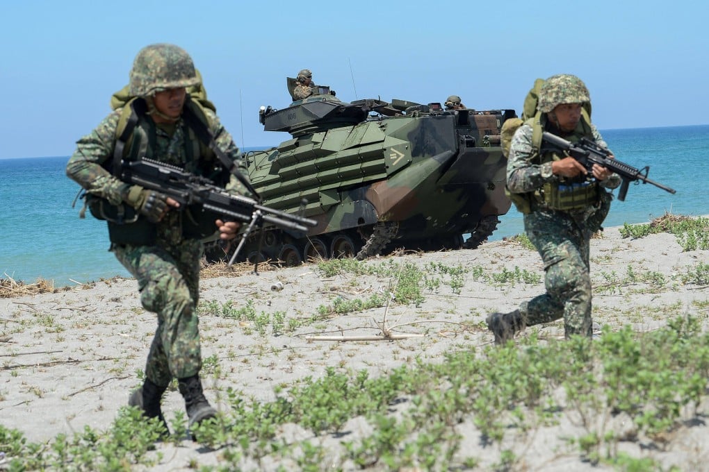 Filipino marines take position next to a US amphibious assault vehicle during a joint exercise in 2018. Japan is considering providing radars to the Philippines to help it monitor Chinese activity in the contested South China Sea, local media reported. Photo: AFP