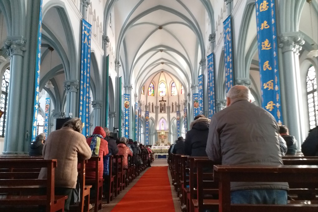 Worshippers are seen at a Catholic church in Shanghai in February 2018. Photo: Mimi Lau