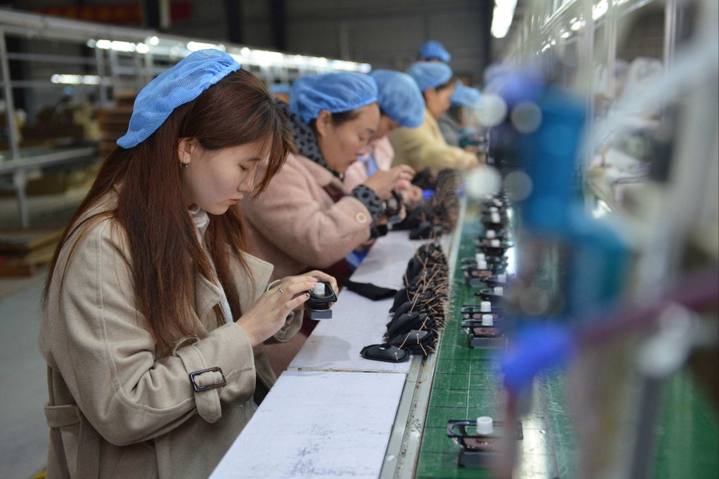 Employees assemble speakers at a factory in Fuyang in China’s eastern Anhui province on March 31, 2023. Photo: AFP