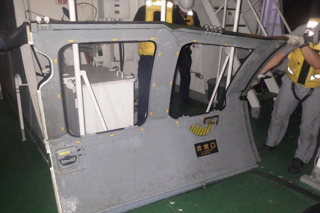 A door believed to be from the missing Japanese military helicopter was recovered from the sea near Miyakojima, Okinawa prefecture, on April 7. Photo: Japan coastguard/Reuters