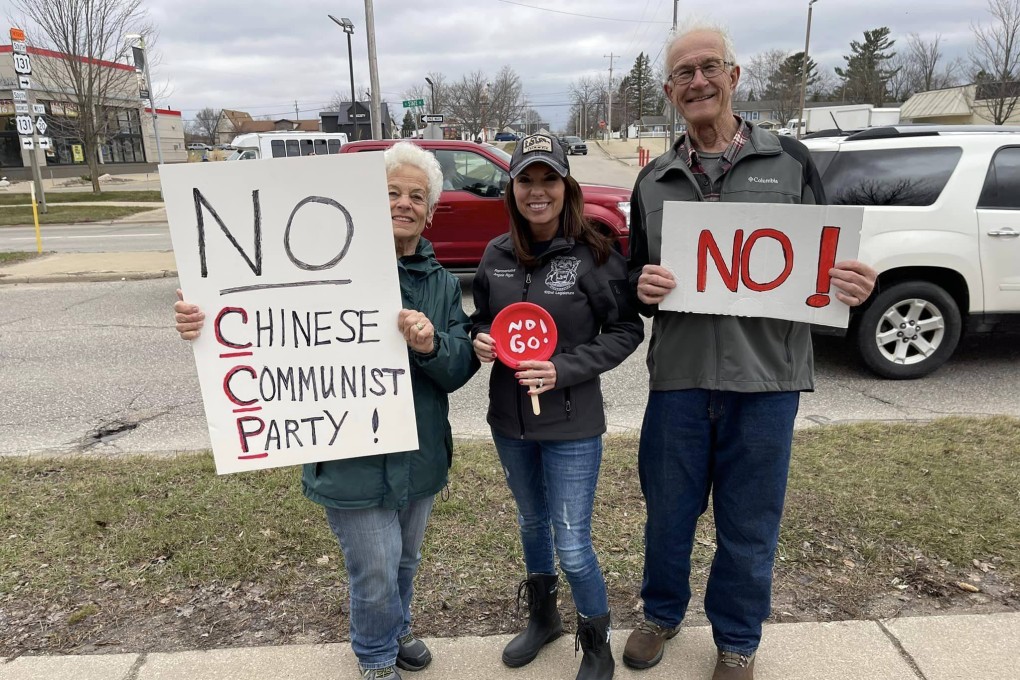 Michigan Republican state representative Angela Rigas (centre) joins protesters outside Ferris State University in Big Rapids, Michigan, on Wednesday. Photo: Angela Rigas