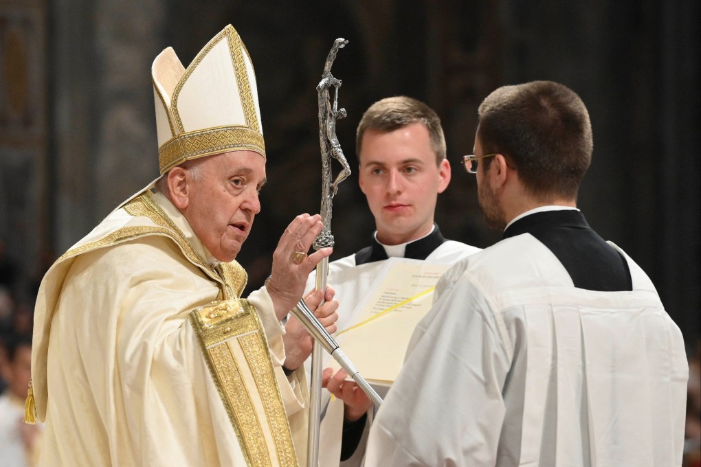 Pope Francis presides over the Easter Vigil in Saint Peter’s Basilica at the Vatican on Saturday. Photo: Vatican Media / Handout via Reuters