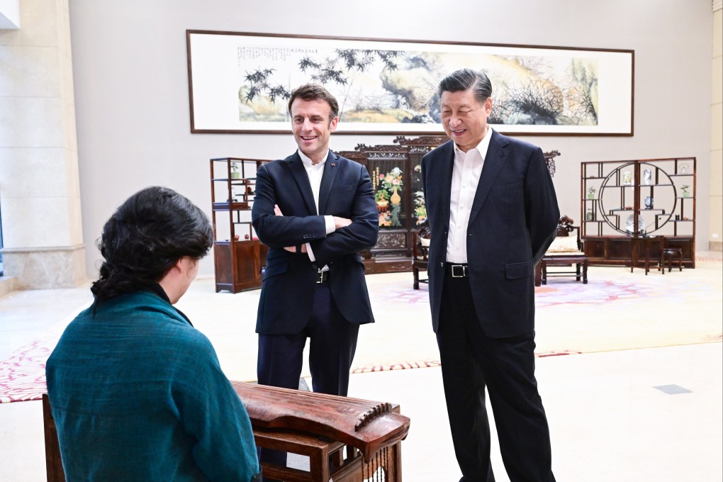 Chinese President Xi Jinping and French President Emmanuel Macron listen to a musical performance in Guangzhou on Friday. Photo: EPA-EFE