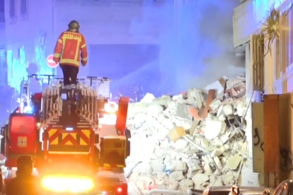 A firefighter inspects rubble after a building collapsed in Marseille, France, on Sunday. Photo: via Reuters