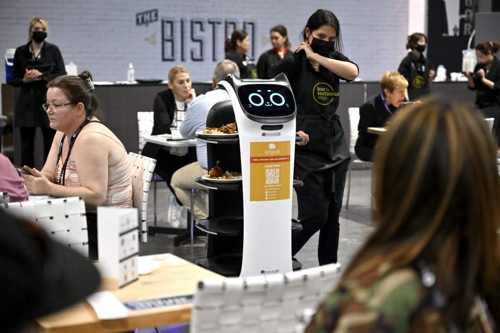 A robot waiter serves food at a Las Vegas convention centre. Robot waiters are becoming more popular with restaurant owners worldwide, although some observers believe they are still just a gimmick. Photo: Getty Images