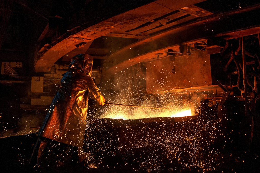 A worker operates a nickel-smelting furnace at an Indonesian mining company. Nickel is one of the main components in the making of EV batteries. Photo: AFP