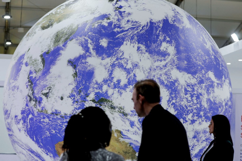 Attendees stand during the COP27 climate summit in Sharm el-Sheikh, Egypt in November 2022. Photo: Reuters