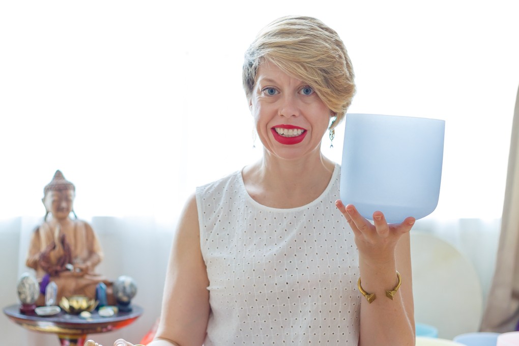 Jessica Coup with a Tibetan singing bowl she uses at the start of a reiki session to help her clients relax, or even sleep.  Reiki is an energy healing art that seeks to balance chi and loosen up energy blockages by balancing the body’s chakras, or energy centres. Photo: Jessica Coup