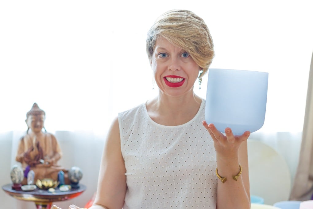 Jessica Coup with a Tibetan singing bowl she uses at the start of a reiki session to help her clients relax, or even sleep. Reiki is an energy healing art that seeks to balance chi and loosen up energy blockages by balancing the body’s chakras, or energy centres. Photo: Jessica Coup