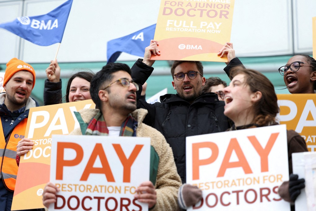 People attend a protest by junior doctors, amid a dispute with the government over pay, in London on March 13. Photo: Reuters