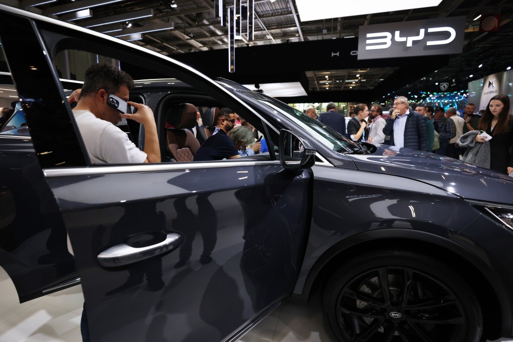 People visit the BYD stand during the Paris Motor Show in October last year. Photo: Xinhua