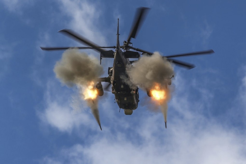 A helicopter gunship is seen firing rockets. Witnesses said a Myanmar military helicopter fired at the site in Kanbalu township after a jet had dropped bombs on the area. Photo: Russian Defence Ministry Press Service via AP