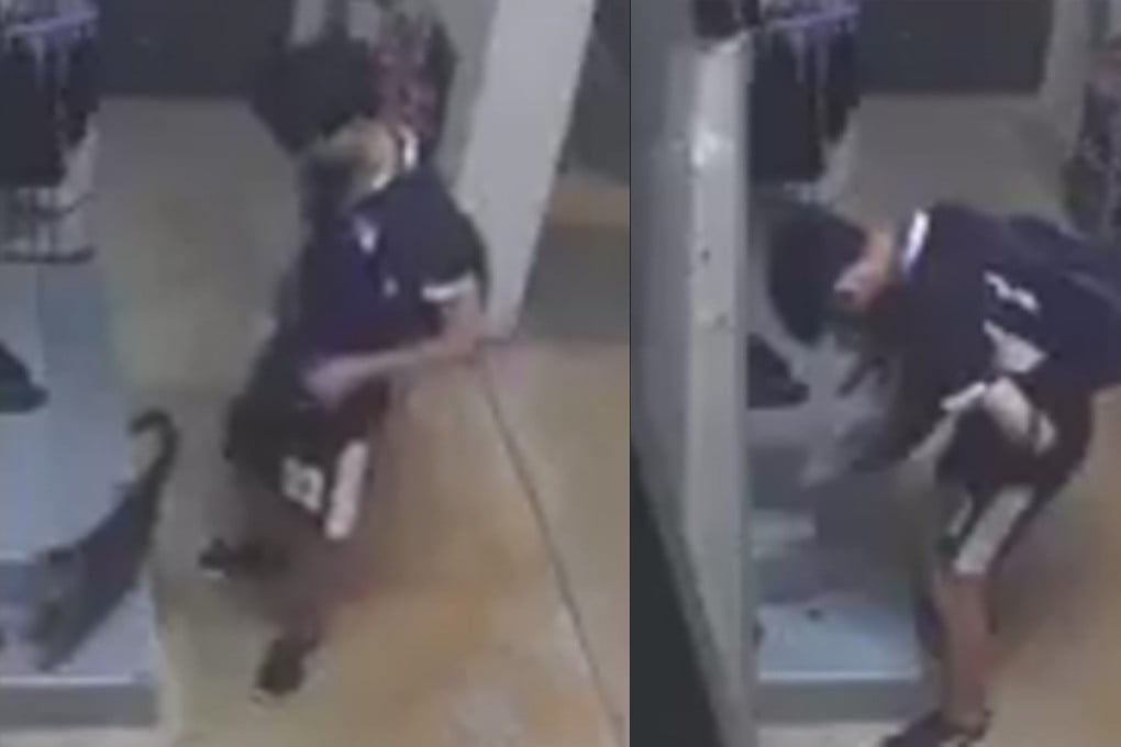 Screenshots from online footage show a male teen picking up a cat as it tries to crawl away. Photo: Facebook/Sayang Our Singapore’s Community Cats