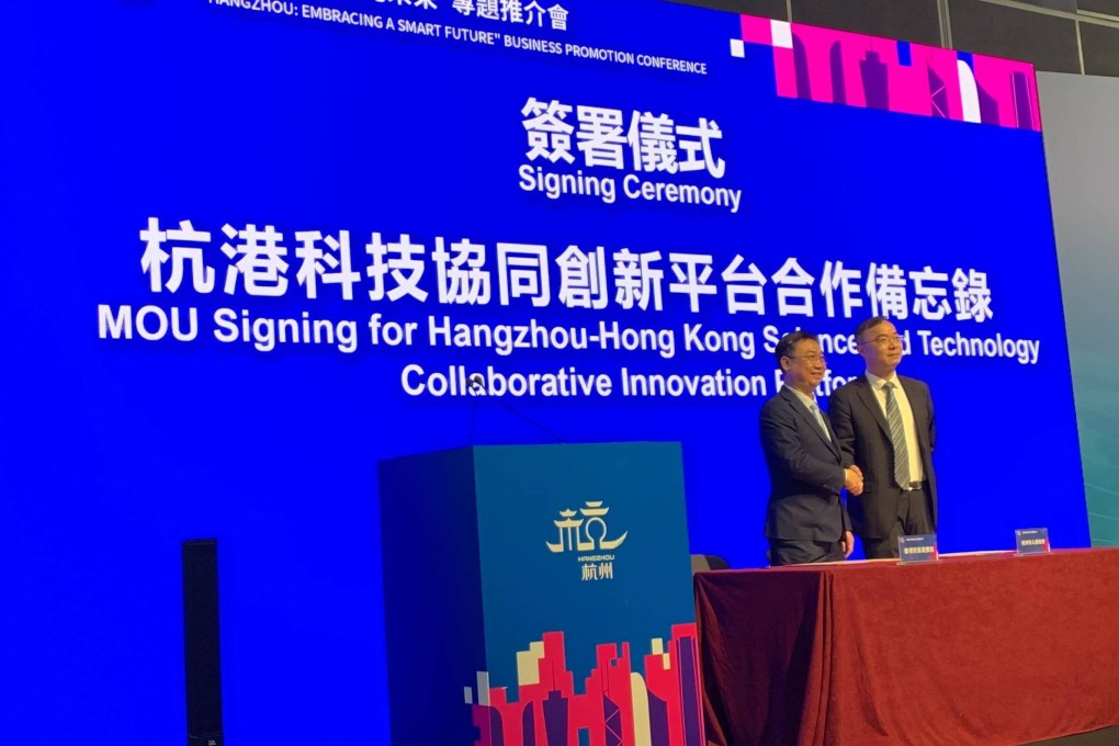 Jacky Chung (left), director of Chinese Mainland at the Hong Kong Trade Development Council, and Hangzhou’s deputy mayor Sun Xudong sign memorandums of understanding in Hong Kong on April 12, 2023. Photo: Xinmei Shen