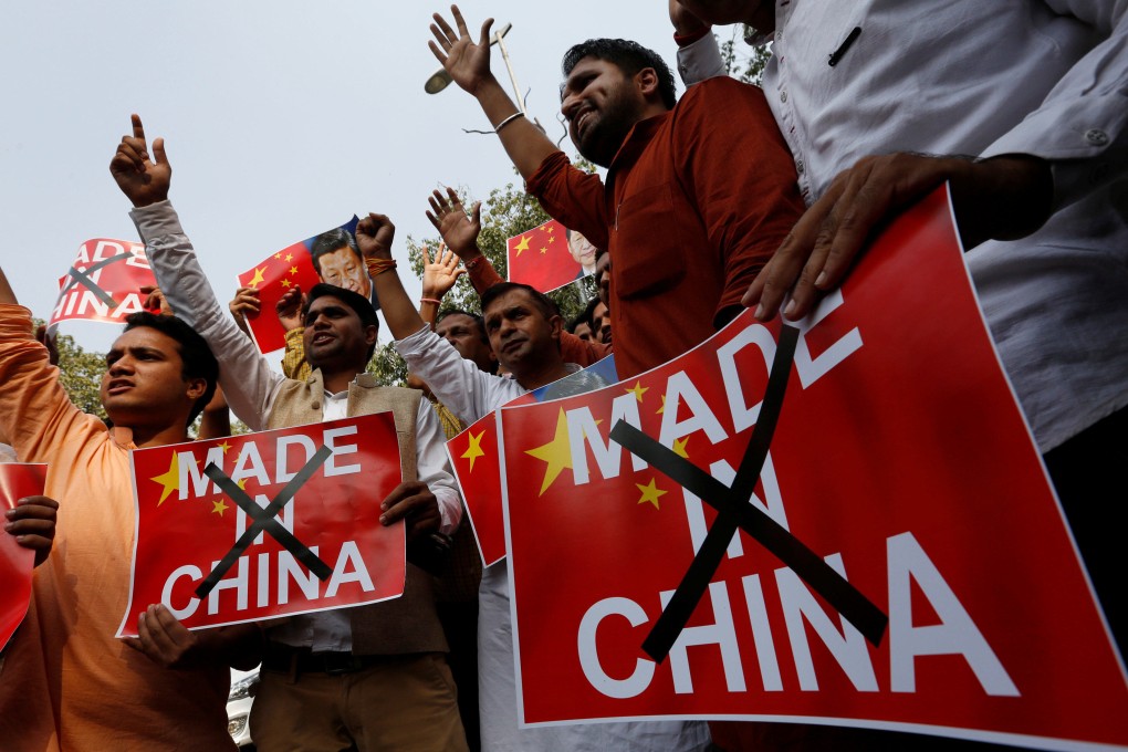 Hindu nationalist protesters shout slogans in New Delhi as they demand a boycott of Chinese products in 2016. A new study has found that Chinese imports play a crucial role in India’s economy. Photo: Reuters