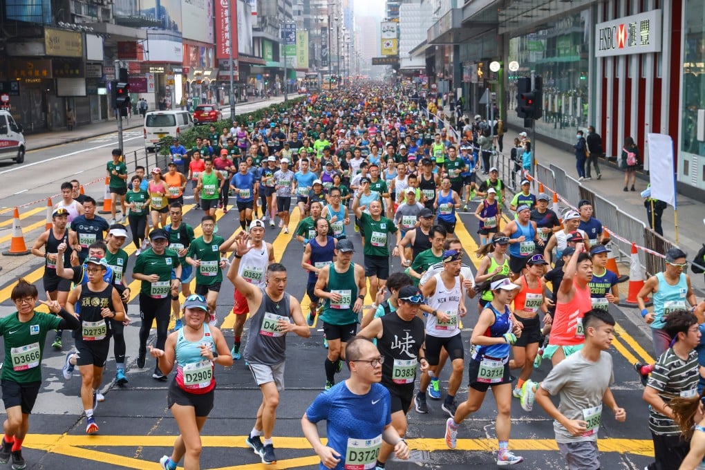 Runners make their way through Mong Kok during the Standard Chartered Hong Kong Marathon in February. Photo: Dickson Lee