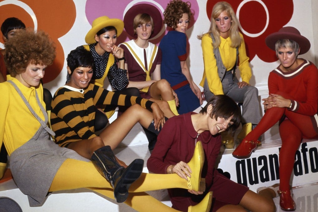 British fashion designer Mary Quant, front centre, poses with models wearing her creations, in London in 1967. Photo: AP