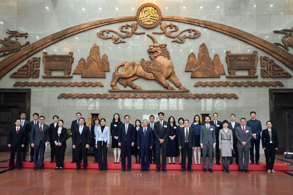 The Bar Association delegation takes a group photo at the Supreme People’s Court with its vice-president Yang Wanming. Photo: Handout