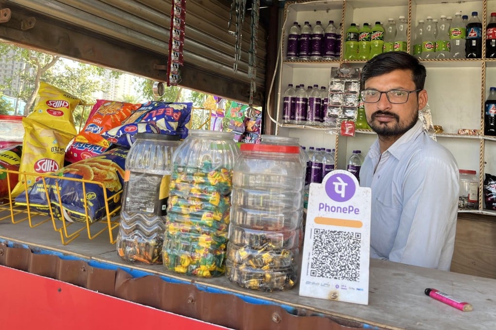 A QR code sign is seen at a roadside paan shop in Gurugram, India. Photo: Amy Sood