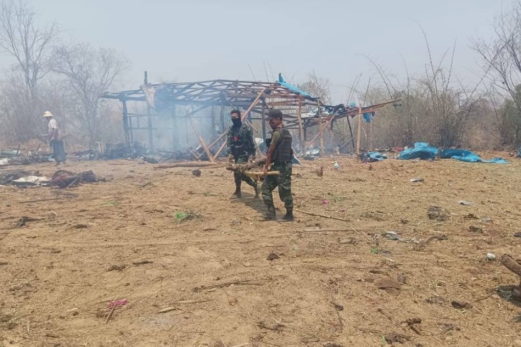 Members of the People’s Defence Force carry the body of a victim after an air strike by the Myanmar military on a village in Sagaing. Photo: EPA-EFE/Myaelatt Athan