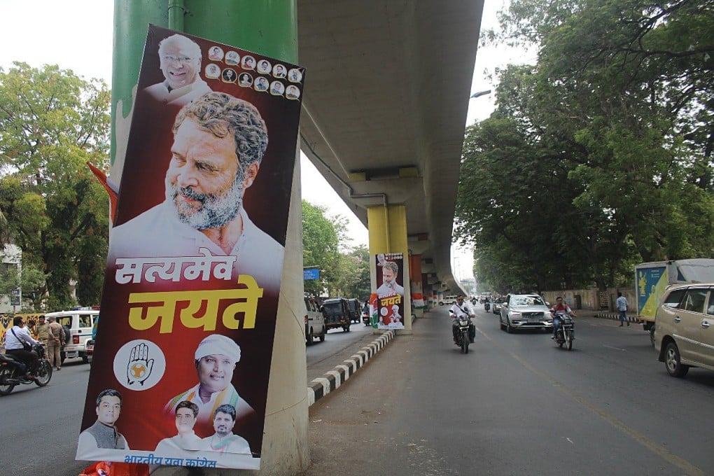 Rahul Gandhi supporters put up posters reading “Truth alone triumphs” in Gujarat, India, on April 3. Gandhi has been sentenced to two years in jail in a criminal defamation case. Photo: EPA-EFE