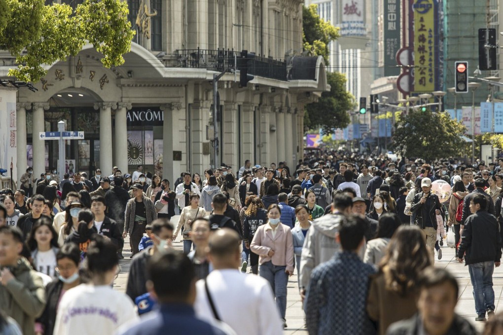 Shoppers swarm Nanjing Road East, one of Shanghai’s main commercial and tourist areas, on April 8. Photo: Bloomberg