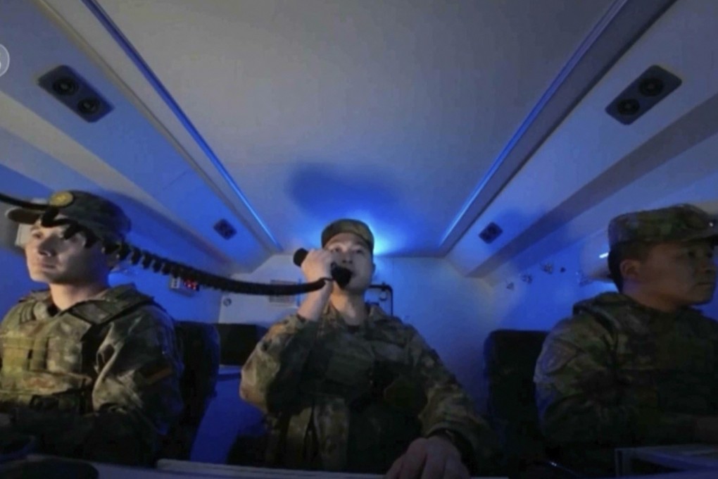 Soldiers maneuver inside a ballistic missile launch command centre during a military drill at an unspecified location in China. Image: CCTV via AP