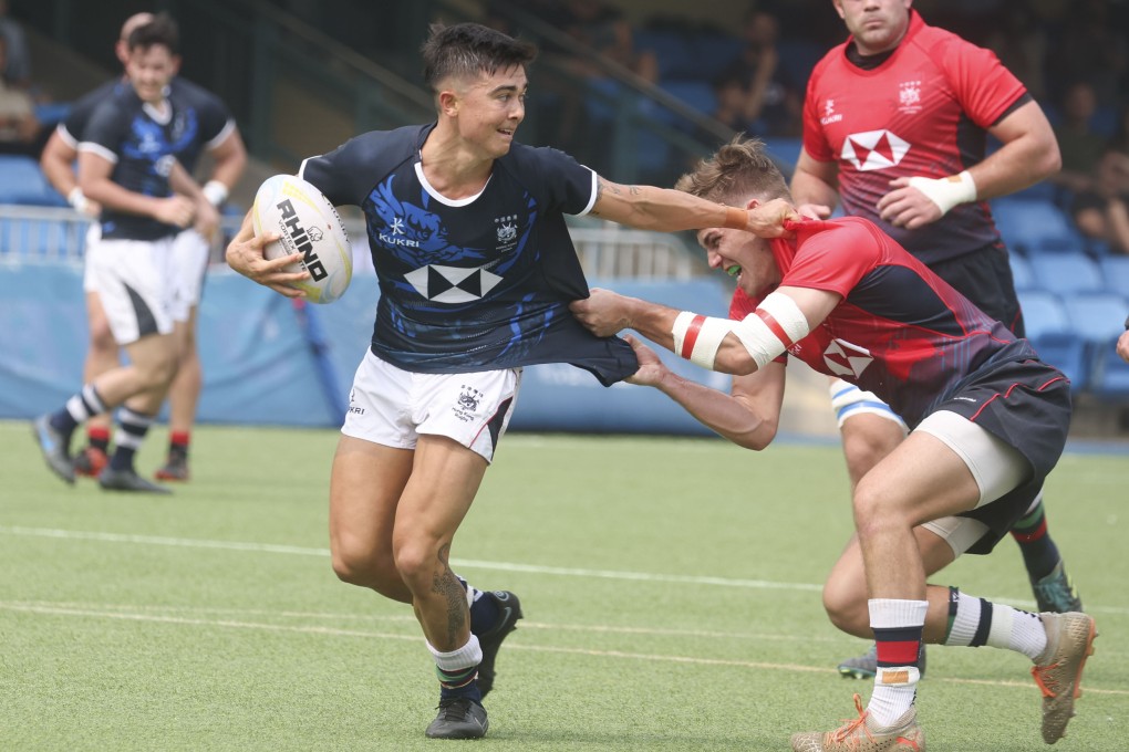 HK C Dragons scrum-half Harry Laidler tries to break a tackle during his side’s game against a World XV. Photo: Yik Yeung-man