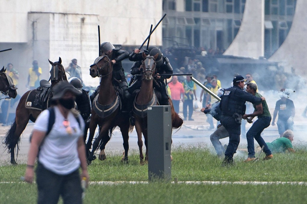 Supporters of Brazilian former president Jair Bolsonaro clash with security forces at the Planalto Presidential Palace in Brasilia in January. Photo: AFP