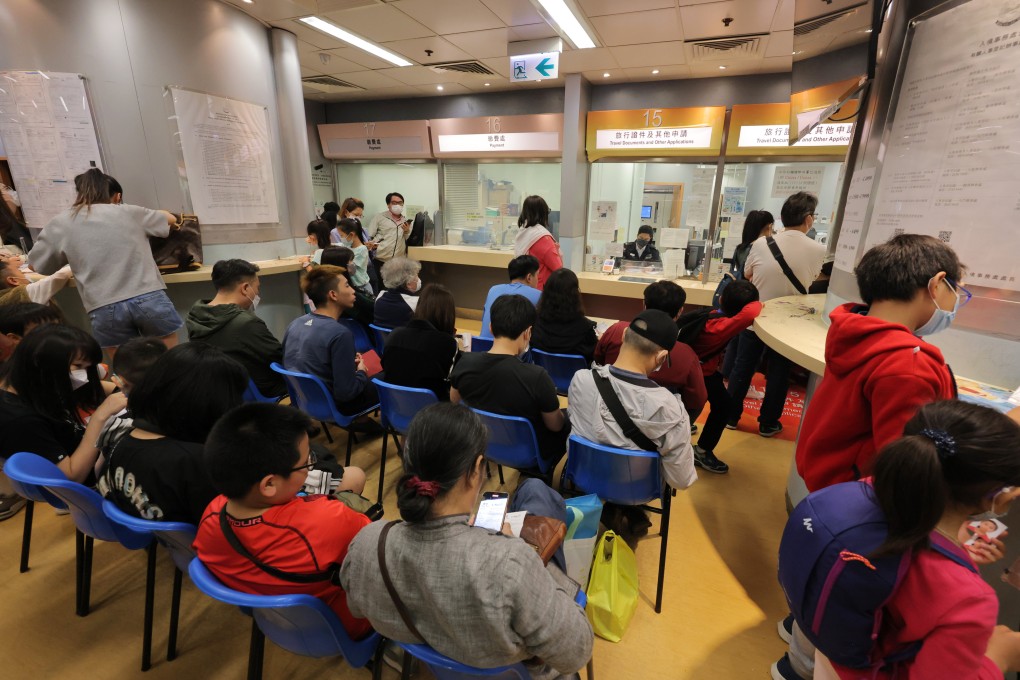 People wait to apply for travel documents at the Immigration Department West Kowloon Branch Office in Tsim Sha Tsui. Photo: Jelly Tse