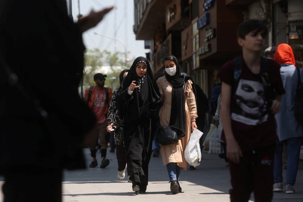 Iranian women walk on a street amid the implementation of the new hijab surveillance in Tehran, Iran on April 15, 2023. Photo: via Reuters