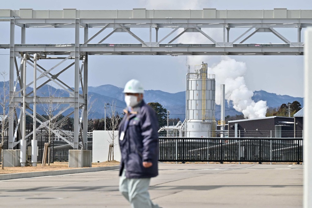 A worker at the “Fukushima Hydrogen Energy Research Field” (FH2R), one of the largest test facilities in the world producing hydrogen from renewable energy, in Namie, Fukushima prefecture, Japan. Photo: AFP