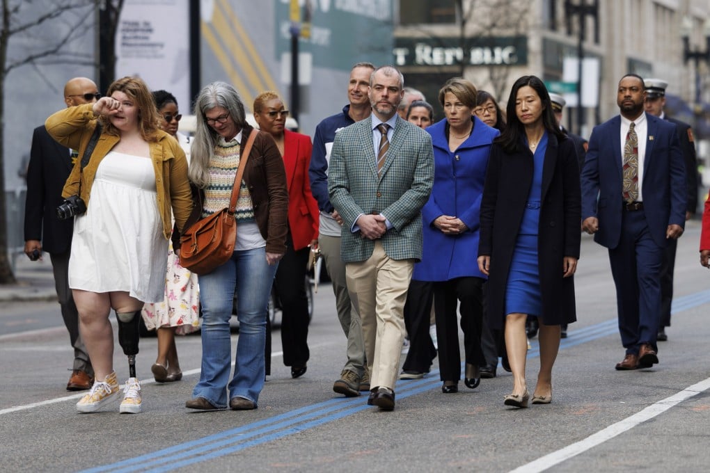Family members of the victims of the Boston Marathon bombing walk down Boylston street to one of the two memorial sites on the 10th anniversary in Boston, Massachusetts, US on Saturday. Photo: EPA-EFE