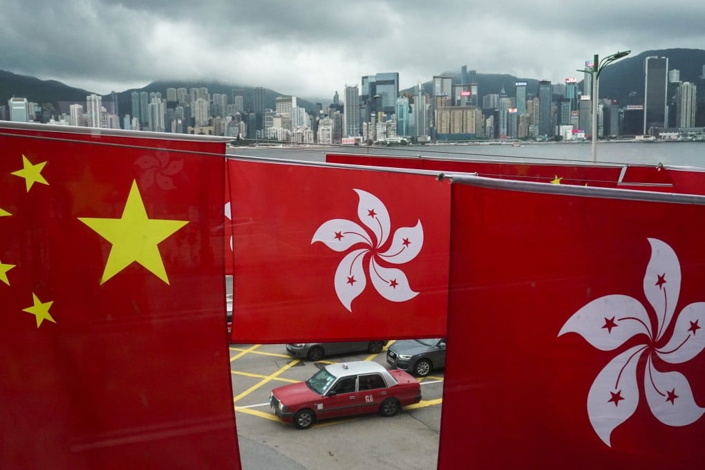 City and national flags fly against the backdrop of Hong Kong’s skyline. Cultural tolerance is highly conducive to attracting global talent, investors and consumers, Beijing official Zheng Yanxiong says. Photo: Felix Wong