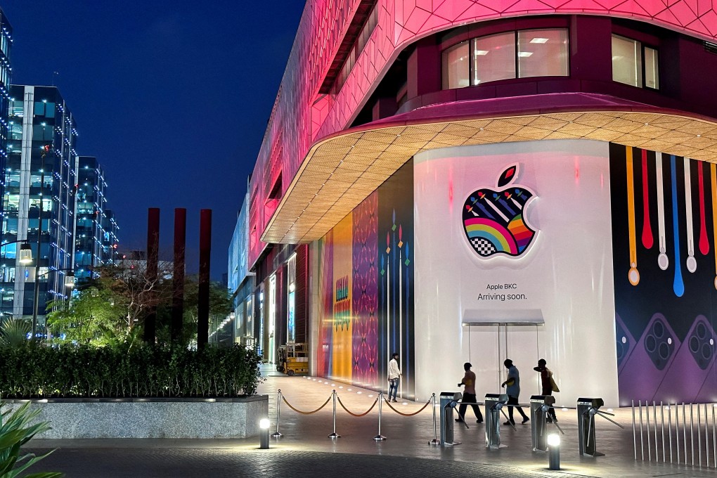 People walk past an advertising hoarding on India’s first Apple retail store in Mumbai, which is set to open on Tuesday. Photo: Reuters