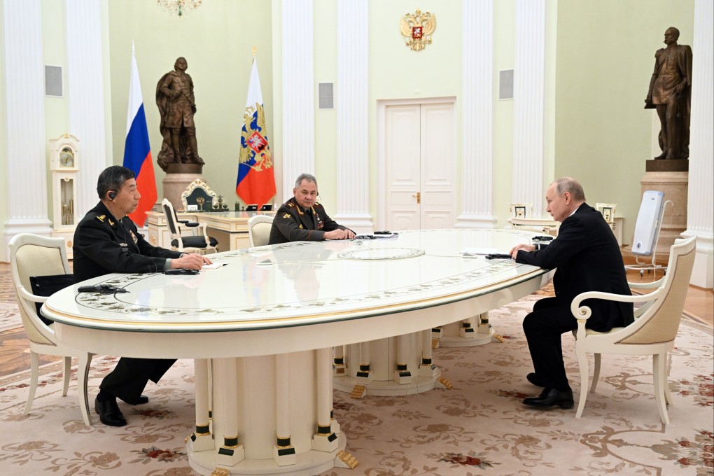 Russian President Vladimir Putin (right) holds talks with Chinese Defence Minister Li Shangfu (left) and Russian Defence Minister Sergei Shoigu at the Kremlin in Moscow on Sunday. Photo: AP