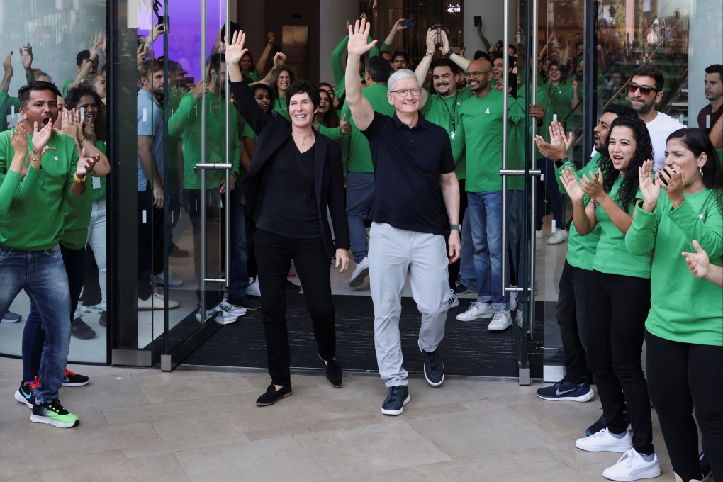 Apple chief executive Tim Cook and Deirdre O’Brien, Apple’s senior vice-president of retail and people, welcome customers at the opening of India’s first Apple retail store in Mumbai on April 18, 2023. Photo: Reuters