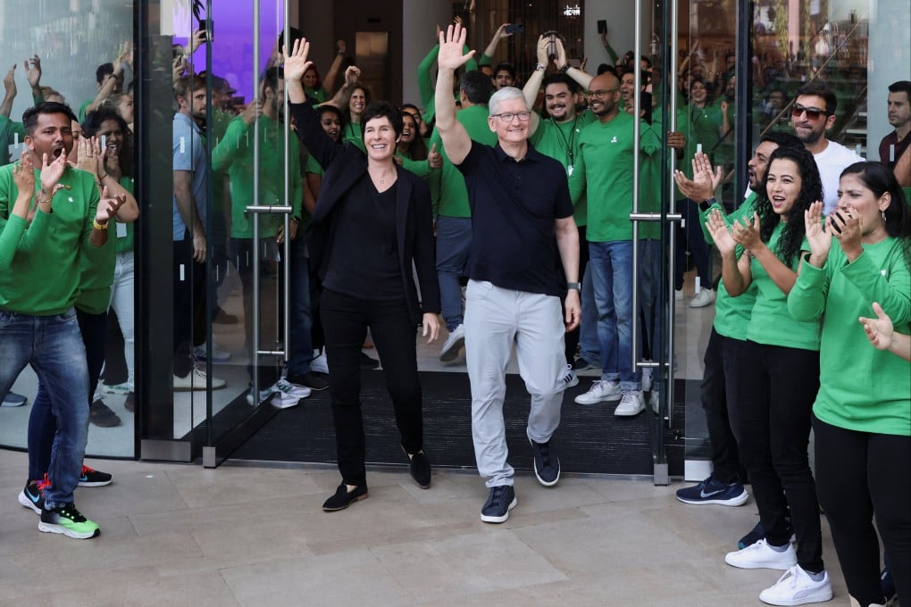 Apple chief executive Tim Cook and Deirdre O’Brien, Apple’s senior vice-president of retail and people, welcome customers at the opening of India’s first Apple retail store in Mumbai on April 18, 2023. Photo: Reuters