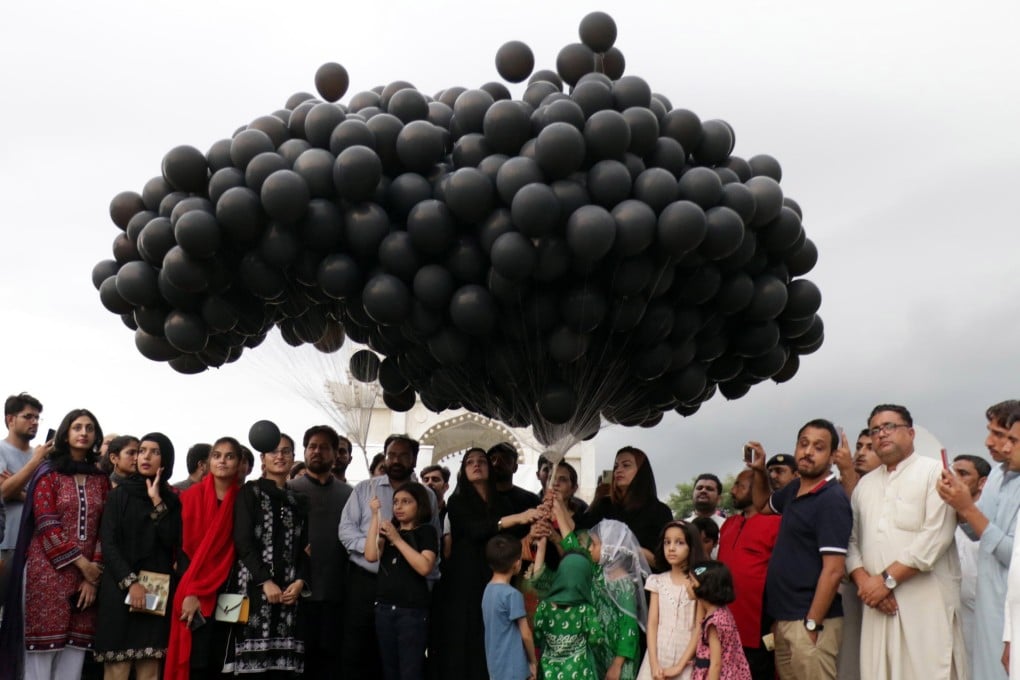 People release black balloons to protest against alleged Indian aggression in Indian-administered Kashmir on India’s Independence Day, in Islamabad, Pakistan, on August 15 last year. Pakistan and India have fought two of their three wars over Kashmir. Photo: EPA-EFE