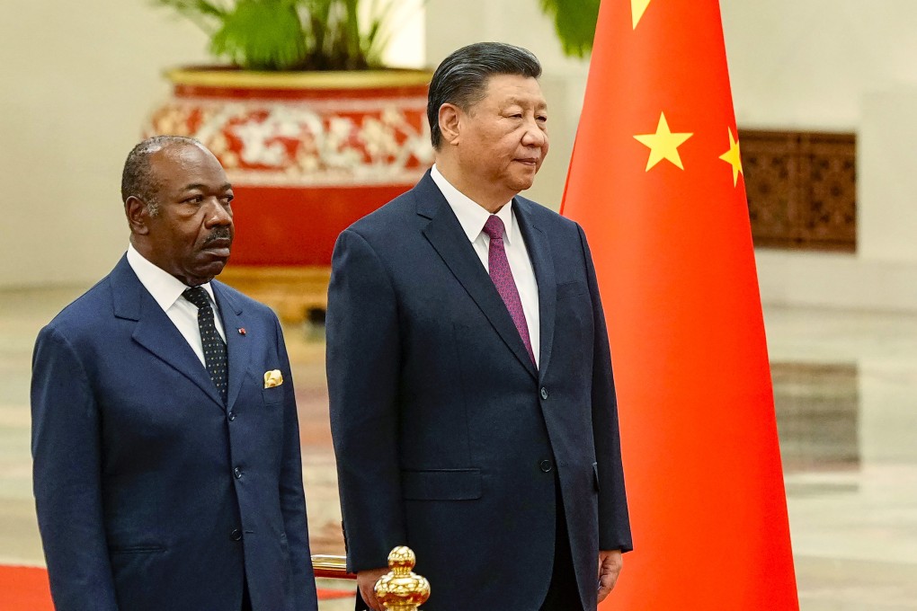 Gabonese President Ali Bongo Ondimba and Chinese leader Xi Jinping inspect an honour guard during a welcome ceremony at the Great Hall of the People in Beijing on Wednesday. Photo: AP