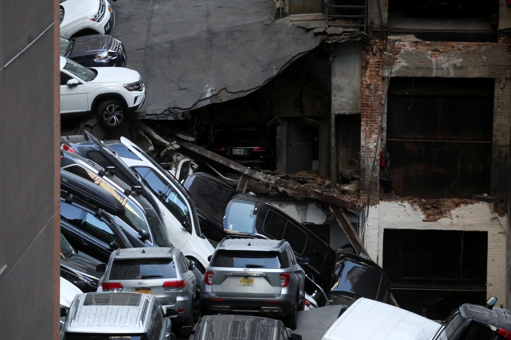 Cars and debris are seen at the site of a collapsed parking garage in New York on Tuesday. Photo: Reuters