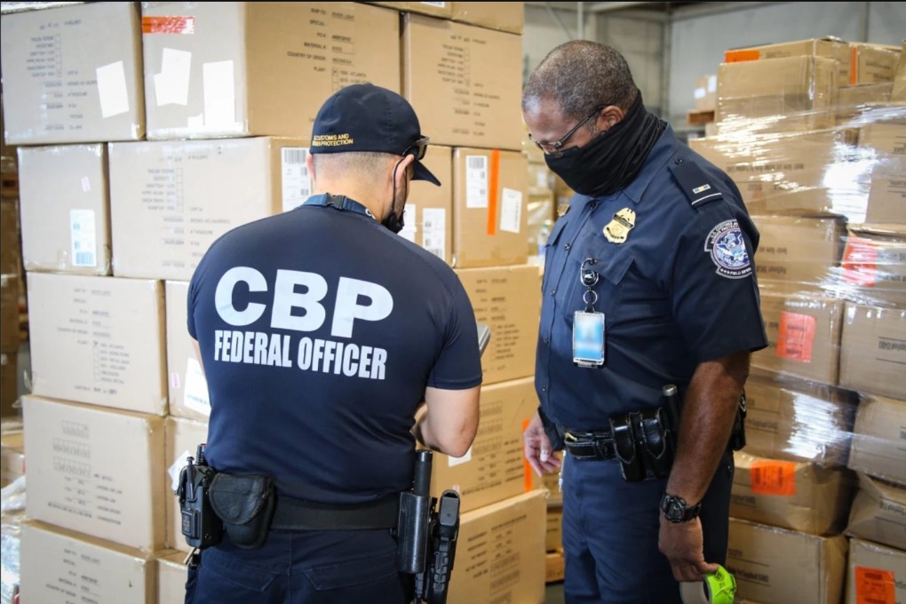 US customs officers inspect apparel suspected to have been made with cotton harvested by forced labour in China’s Xinjiang region. Photo: US Customs and Border Protection