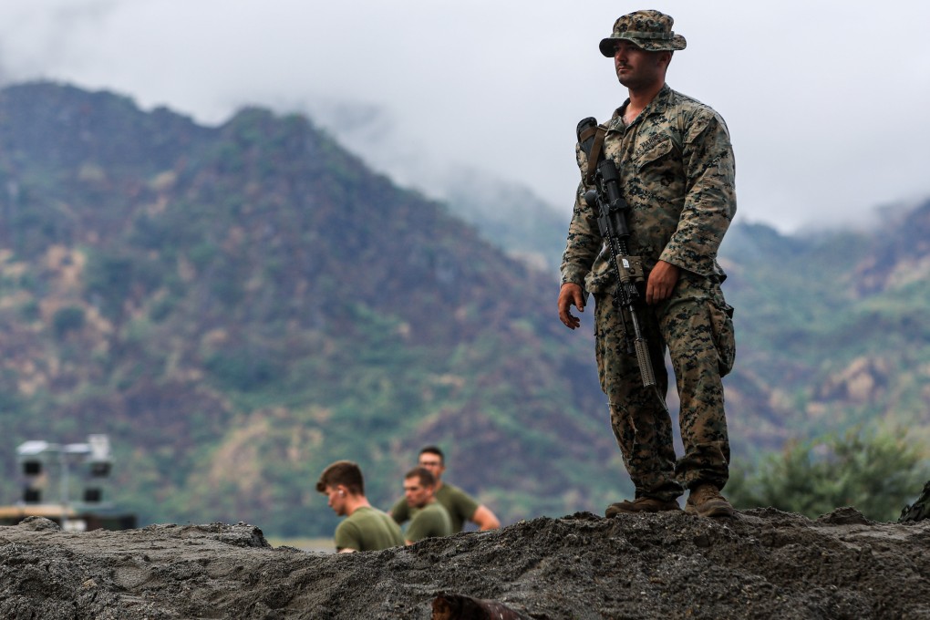 US soldier stands guard at a military base during live fire exercise during the US-Philippines Balikatan military drills. Photo: dpa