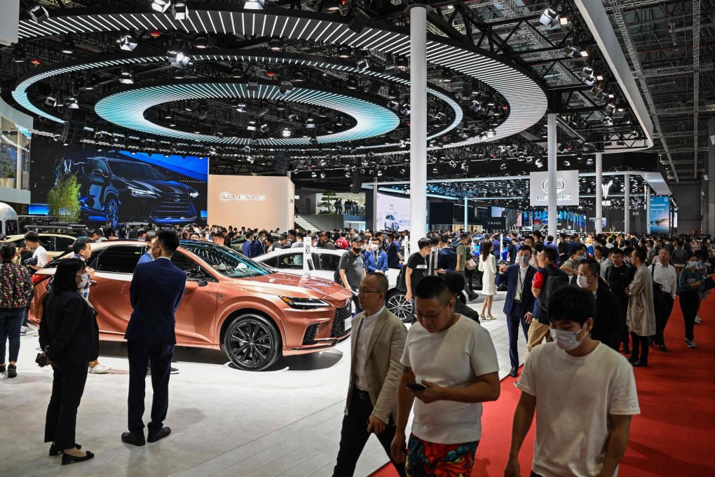 People visit the Lexus booth at the Shanghai Auto Show on Thursday. The 10-day event ends on April 27. Photo: AFP