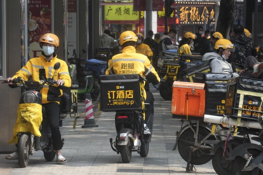 Meituan food delivery riders bringing takeaway food to customers on the streets of Guangzhou on February 23, 2023. Photo: SCMP / Elson Li