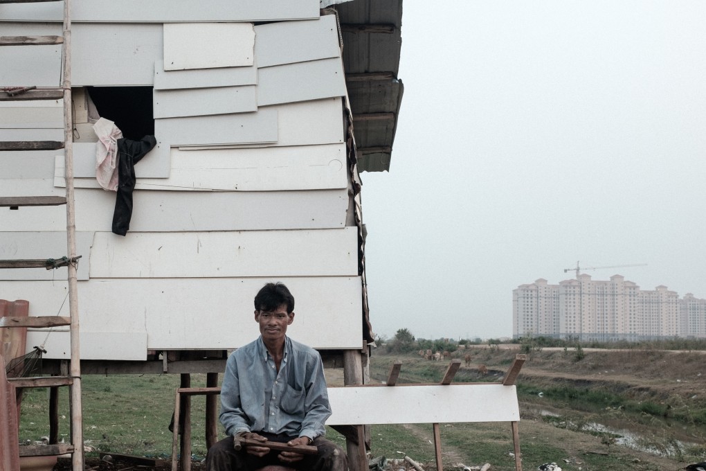 A farmer in front of his home on the boundary of the That Luang Lake Specific Economic Zone in Vientiane Laos. His and others’ livelihoods are at risk as their source of water dries up thanks to a Chinese developer. Photo: Nicholas Bosoni