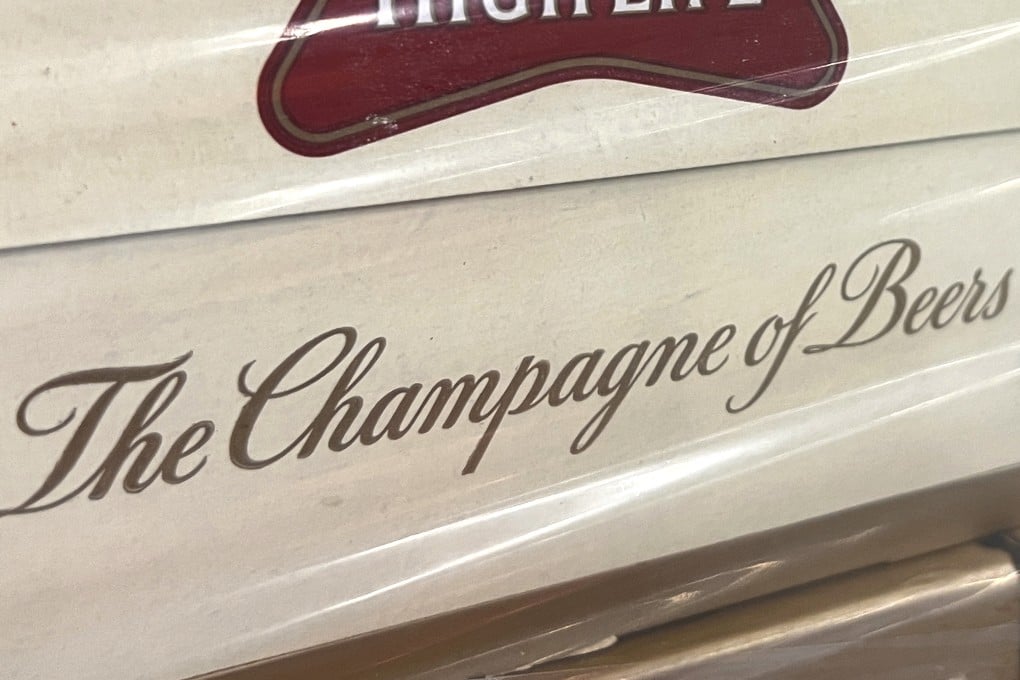 A label on the side of a carton of Miller High Life beer showing its famous slogan. Photo: AP